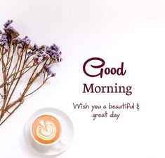 a cup of coffee sitting on top of a saucer next to some lavender flowers