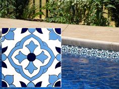 a blue and white tile next to a swimming pool