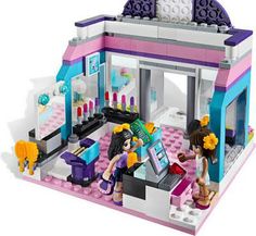 a lego set is shown with people in it