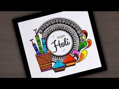 a card with the words happy holi written on it and colorful objects around it