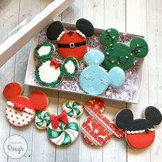 some decorated cookies in a box on a table