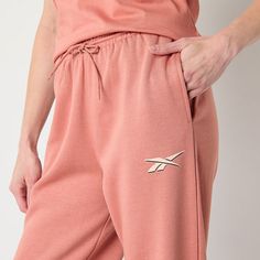 You'll love the vibrant pink hue and sporty aesthetic of these Reebok women's mid-rise fleece jogger pants for lounging or workouts. Crafted from 100% cotton, these cuffed-leg joggers come lined with an embroidered logo, slip pockets, and an elastic-drawstring waist. Wear them with a tee to complete the look. Front Style: Flat FrontClosure Type: Drawstring, Full ElasticFit: Regular FitPockets: 2 Side Slip PocketsRise: Mid RiseFiber Content: 100% CottonFabric Description: FleeceLining: LinedLini… Sporty Aesthetic, Pants Jogger, Reebok Women, Fleece Joggers, Womens Fleece, Jogger Pants, Drawstring Waist, Mid Rise, Pants