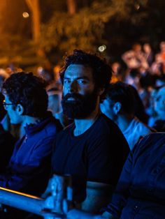 a group of people sitting next to each other