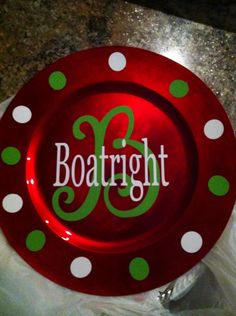 a red plate with green polka dots and the word boatright on it in white lettering