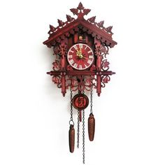 a red and white cuckoo clock on a white background with the pendulums pointing upward