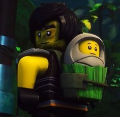 the lego movie character is holding an object