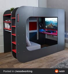 a child's bed with a built in tv