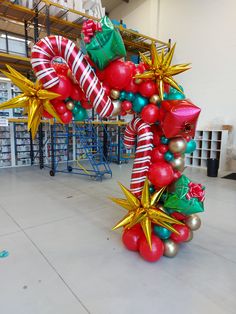 an inflatable christmas decoration with red, green and gold decorations