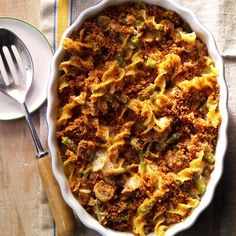 a casserole dish with broccoli and meat in it on a table