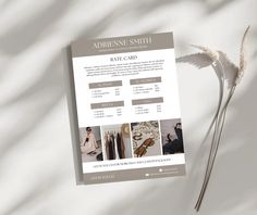 a brochure that is sitting on top of a white sheet with some flowers in it