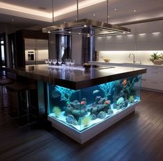 an aquarium in the middle of a kitchen island