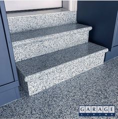 the steps are made of granite and have blue trimmings on each one side