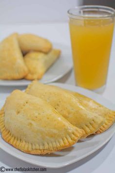 two plates with pastries and a glass of orange juice