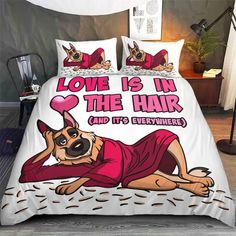 a bed with a dog on it and the words love is in the hair