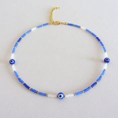 Evil eye choker blue evil eye necklace evil eye necklace seed bead choker necklace boho necklace beaded necklace blue choker choker necklace seed bead necklace Please measure your neck before ordering. Necklace is 13 inches with a 2 inches adjustable extender chain. 15 inches full length. Blue Dainty Beaded Choker Necklace, Dainty Blue Beaded Choker Necklace, Bohemian Blue Beaded Necklaces With Evil Eye, Blue Evil Eye Beaded Necklaces, Blue Evil Eye Necklace, Evil Eye Choker, Beaded Necklace Blue, Seed Bead Choker, Bead Choker Necklace