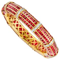 Magnificent 18kt Yellow Gold Bangle Bracelet with Red Rubies and 5ct Square Emerald Cut Diamonds from Estate His Majesty The Sultan Of Oman Qaboos Bin Said Rubies: 420 rubies : Ca. 30 Ct Diamonds: Square cut diamonds, together in total approx. 5 ct. Material: 18 kt. Yellow gold Measurements: Will max fit a 18 cm wrist Total weight: 75.2 gram / 2.655 oz / 48.4 dwt Qaboos Bin Said, Ruby Bracelets, Bracelet Tennis, Ruby Bracelet, Yellow Gold Bangle, Gold Bangle Bracelet, Gold Bangle, Square Cut, Emerald Cut Diamonds