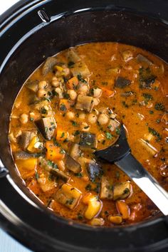 a spoon is in a bowl of soup