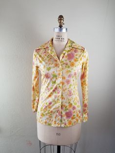 Good vintage condition Bust 38 Shoulders 16 Sleeve 23 CB 25 silky polyester no tags Spring Floral Print Collared Blouse, Spring Floral Print Blouse With Collar, Fitted Floral Print Blouse With Collared Neckline, Fitted Blouse With Floral Print And Collared Neckline, Fitted Yellow Printed Blouse, Vintage Blouse With Collared Neckline, Yellow Vintage Print Top For Spring, Yellow Top With Vintage Print For Spring, Bohemian Collared Floral Print Tops