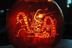 a carved pumpkin with an image of a dragon on it