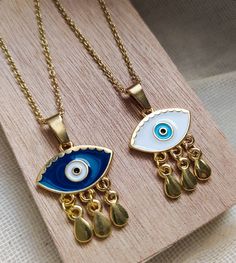 evil eye necklacefortune tellergood luck necklaceevil eye gold charmevil eye golddainty gold necklacegold eye pendantgifts for herdainty necklaceDelicate NecklaceBirthday giftgold necklacelayered necklace Evil eye charm pendant is made of 24k gold plated steel and is handpainted! Customize your necklace by choosing the length of it (35 - 85 cm) and between 2 Evil eye colors! Everything is handmade from the scratch with love and care. All the parts are waterproof,nickel free and antiallergic . Ev Gold Dainty Evil Eye Charm Necklace, Gold Dainty Jewelry With Evil Eye, Gold Evil Eye Dainty Jewelry, Gold Dangle Jewelry With Evil Eye, Dainty Gold Evil Eye Jewelry, Gold Evil Eye Necklace As Gift, Gold Evil Eye Pendant Charm Necklace, Gold Plated Evil Eye Pendant Charm Necklace, Gold Plated Evil Eye Charm Necklace Gift