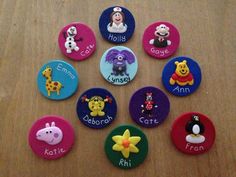 there are many buttons with different animals on them in the shape of letters and numbers