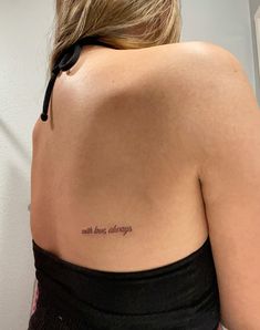 the back of a woman's shoulder with an inscription on it that reads, with love always