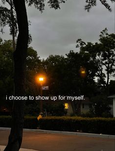 a street light with the words i choose to show up for my self