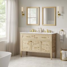 a white bathroom with two mirrors above the sinks and a tub in front of it