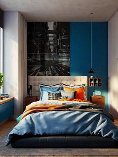 a bed with blue sheets and pillows in a bedroom next to a painting on the wall