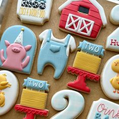 decorated cookies with farm animals and numbers on them