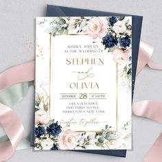 an elegant wedding card with flowers and gold foil on the front, in navy blue and white