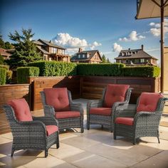 an outdoor patio with chairs and umbrellas