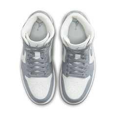 The iconic Air Jordan 1 Mid has been a staple of street style since its debut over two decades ago. Now, a new version brings the timeless design into modern fashion in grey sail tones. This sleek rendition offers an elevated, versatile style with subtle tones that are sure to stand out. The classic silhouette’s upper is crafted from quality leather and suede materials that luxuriously hug your foot for all-day comfort. The dark shade of grey makes the shoe versatile and wearable for any occasio Jordan 1 Mid Stealth, Air Jordan 1 Mid Grey, Jordan 1 Mid Women, Nike Tenis, Transitional Outfits, Jordan Shop, All Jordans, Transition Outfits, Jordan 6