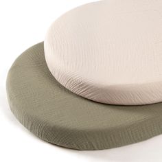 two round cushions sitting on top of each other