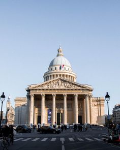 a large building with columns and a dome on top