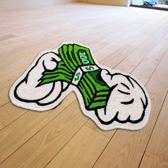 a floor mat that has been made to look like a cartoon character with money on it