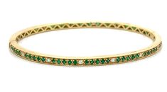 What's better than an emerald & diamond gold bangle? You'll adore the sparkling diamond stones that enrich this bangle with brilliance. You can wear this fabulous bangle with absolutely anything Metal: 18K Yellow GoldDiamond Weight: 1.60ct t.w.Diamond Shape: 13 Round Brilliant cuts 0.21ct tw, 70 Emerald: 1.39ct twSetting: ProngBangle Width: 57 x 47mm Necklace Guide, Diamond Initial Necklace, Yellow Gold Bangle, Jewelry Appraisal, Bridal Engagement Rings, Sparkling Diamond, Eternity Wedding Band, Jewelry Rings Diamond, Gold Bangle Bracelet