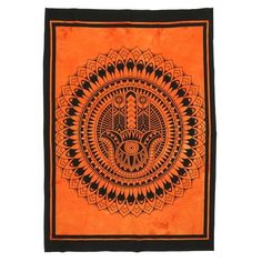 an orange and black wall hanging with a hamsah design on the front side