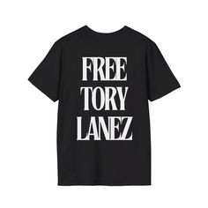 Show your support with this graphic tee featuring an image of rapper Tory Lanez on the front and a powerful 'Free Tory Lanez' message on the back. Crafted from premium cotton for a comfortable fit, this shirt combines bold style with a meaningful statement. The unisex soft-style t-shirt puts a new spin on casual comfort. Made from very soft materials, this tee is 100% cotton for solid colors. Heather colors and sports grey include polyester. The shoulders have twill tape for improved durability. Urban Streetwear T-shirt With Back Print, Hip Hop Style T-shirt With Letter Print For Fans, Hip Hop Slogan Tops For Streetwear, Urban T-shirt With Back Print For Streetwear, Edgy Fan Merchandise T-shirt With Logo Print, Edgy T-shirt For Fan Merchandise With Logo Print, Edgy T-shirt With Logo Print For Fan Merchandise, Edgy T-shirt With Logo Print For Concerts, Edgy Concert T-shirt With Logo Print