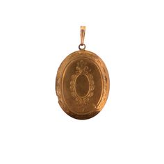 A vintage gold tone oval locket pendant. The gold plating shows quite a bit of wear but it gives it a great vintage look. Including the bail, the piece is a little over 1.5 inches long. Gold Locket Necklace With Vintage Charm, Gold Pendant Locket Necklace With Vintage Charm, Classic Gold Locket Necklace With Vintage Charm, Classic Antique Gold Locket Necklace With Vintage Charm, Gold Heirloom Locket Necklace With Antique Finish, Heirloom Gold Locket Necklace With Antique Finish, Gold Locket Necklace With Vintage Charm And Round Pendant, Victorian Antique Gold Oval Locket Necklace, Vintage Yellow Gold Oval Locket Necklace