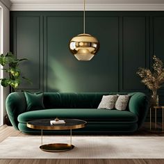 a living room with green couches and gold accents on the walls, along with a round coffee table