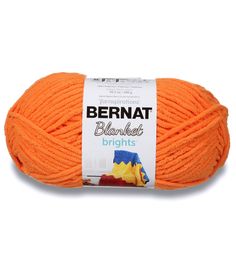 bernat blanket brights yarn in orange, on a white background with the label