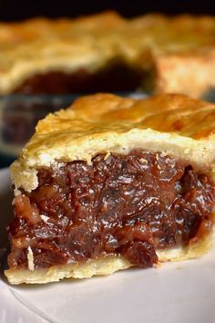 a piece of pie sitting on top of a white plate