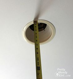 a ceiling fan with a measuring tape on it