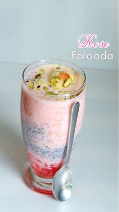 a dessert in a glass with a spoon next to it and the words rose faloada above it