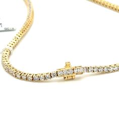 This exquisite 6.03ct tw diamond riviera line tennis necklace is the ultimate in luxurious sophistication. Expertly crafted to perfection, embellished with shimmering diamonds that add a heavenly sparkle. Elevate any look with this diamond-studded statement piece. Metal: 18K Yellow GoldDiamond Details: 210 Brilliant Round Cut Diamonds 6.03ct tw Length: 16" - 42cm Estimated production time is 4 - 5 weeks. Tennis Necklace, Round Cut Diamond, Yellow Color, Round Cut, Tennis, Sparkle, Diamonds, White Gold, Yellow Gold