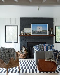 a living room filled with furniture and a fire place