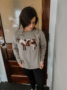 Your favorite graphic applique tee is now in a extremely soft sweatshirt. Handcrafted on a sponge fleece Bella Crew neck sweatshirt using only premium fabrics and threads. Each one handmade to be as unique as the person wearing it. Unisex Fit XS-2X Tape sweatshirt with a brown cow print fabric appique Designed and handmade by our staff. Cow Print Fabric, Applique Tee, Boutique Tops, Country Western, Cow Print, Casual Fall Outfits, Pet Clothes, Dress Accessories, Cow