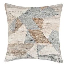 a decorative pillow with an abstract design