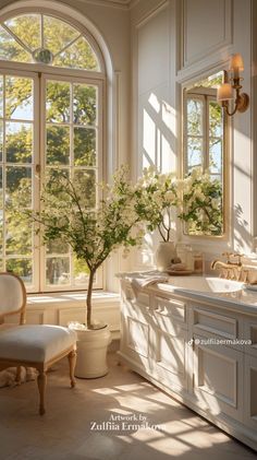 an elegant bathroom with large windows and a potted tree in the corner by the sink